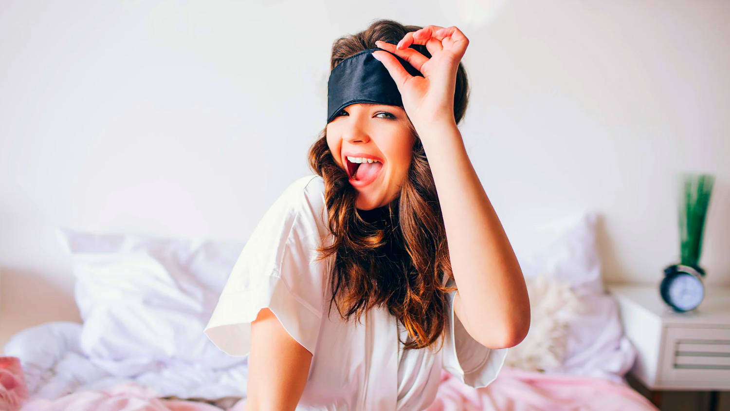 a woman with a blindfold sleep mask on her eyes