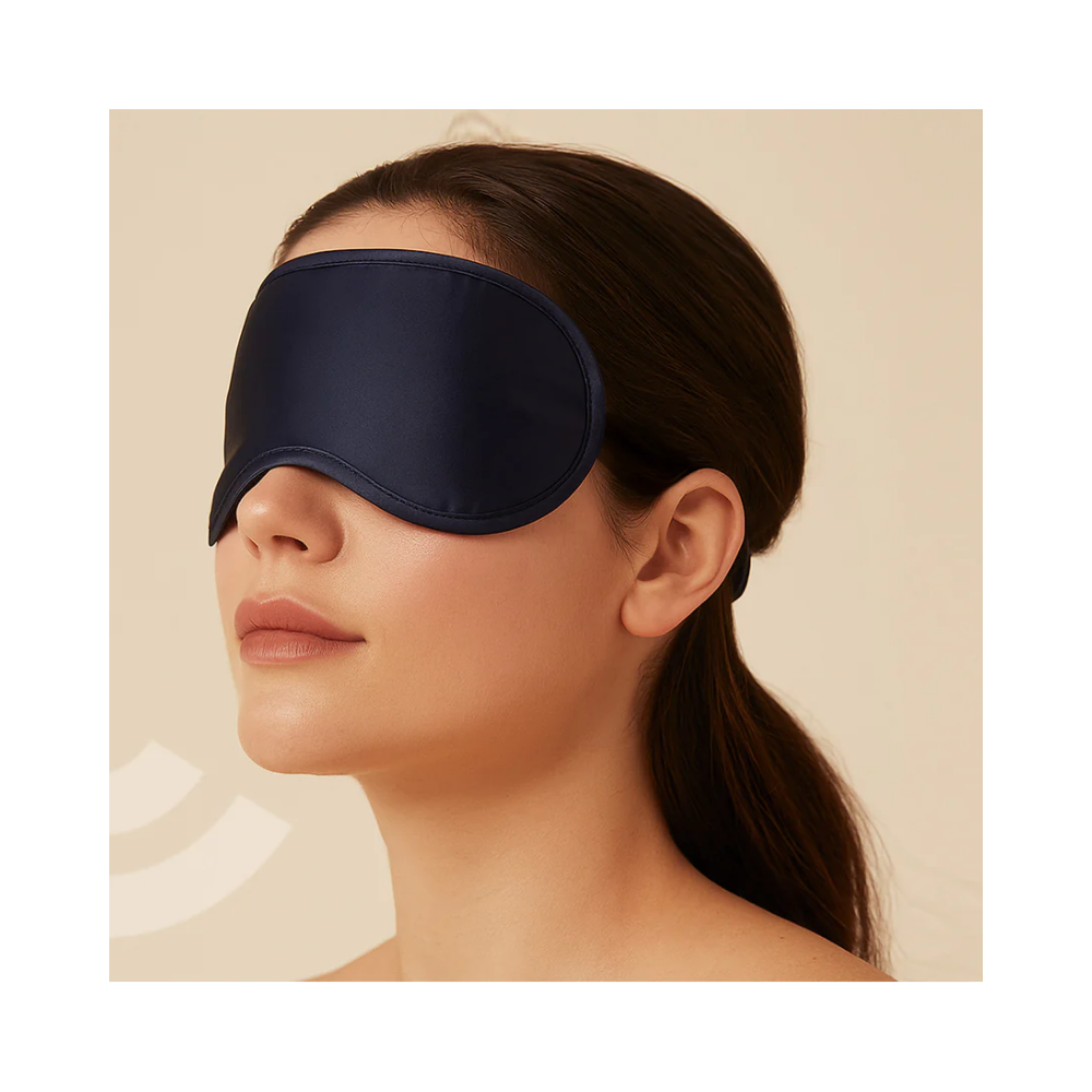 Woman sleeping on airplane wearing a comfortable travel sleep mask