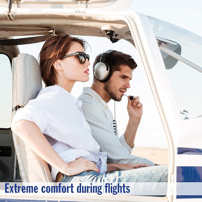 Two people sitting inside a small aircraft, wearing headsets, looking ahead during a flight.