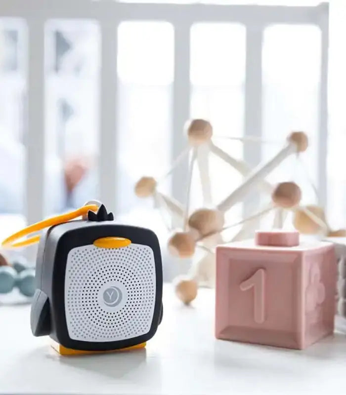 Yogasleep Pocket Baby Soother Sound Machine with calming lullabies and soothing sounds to help babies sleep peacefully on the go