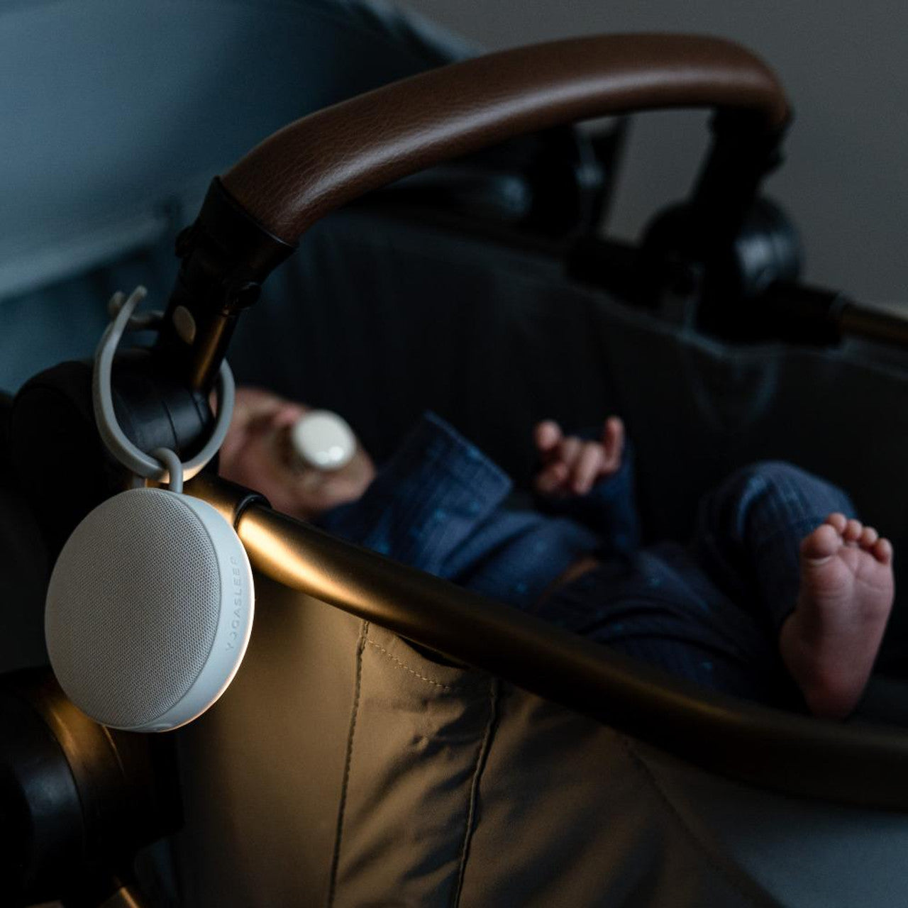 baby sleeping in pram with yogasleep hushh 2 sound machine